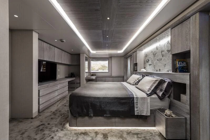 a bedroom with a bed and a tv aboard OURWAY Yacht for Sale