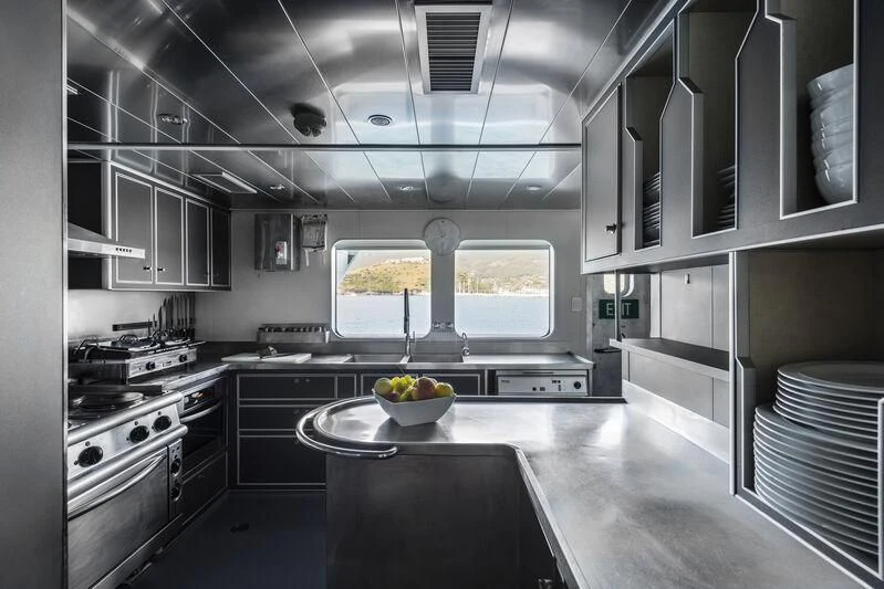 a kitchen with a large window aboard OURWAY Yacht for Sale