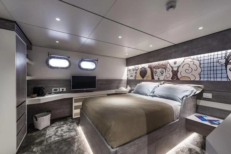 a bedroom with a bed and a tv aboard OURWAY Yacht for Sale