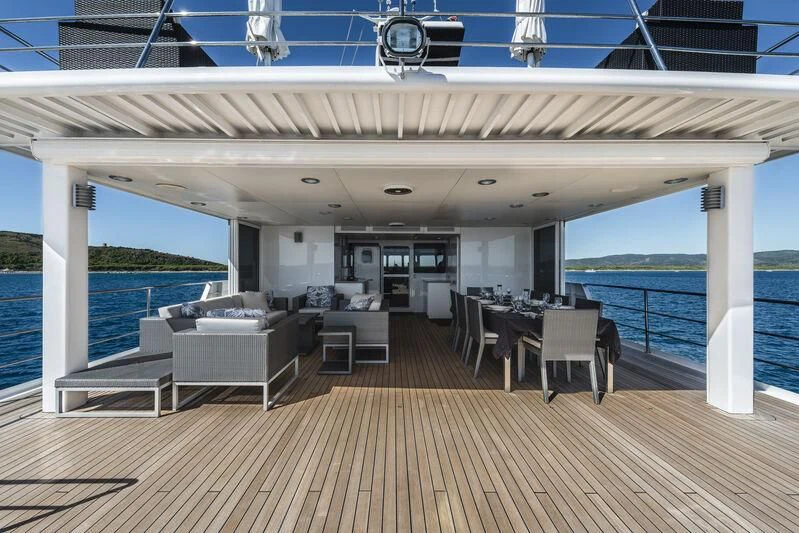 a large room with a deck and a pool aboard OURWAY Yacht for Sale