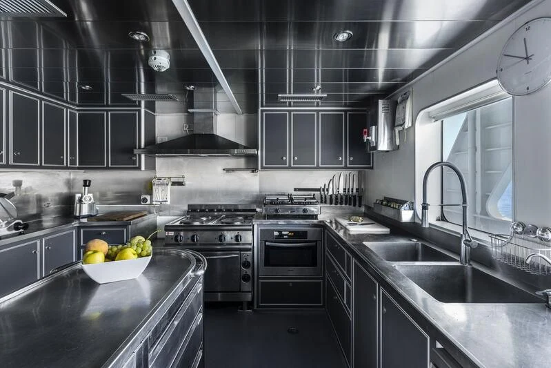 a kitchen with a bowl of fruit aboard OURWAY Yacht for Sale