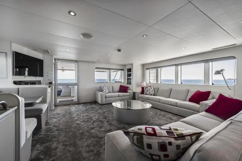a living room with a couch and a table aboard OURWAY Yacht for Sale