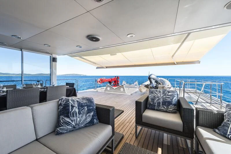 a boat with a couch and a chair on it aboard OURWAY Yacht for Sale