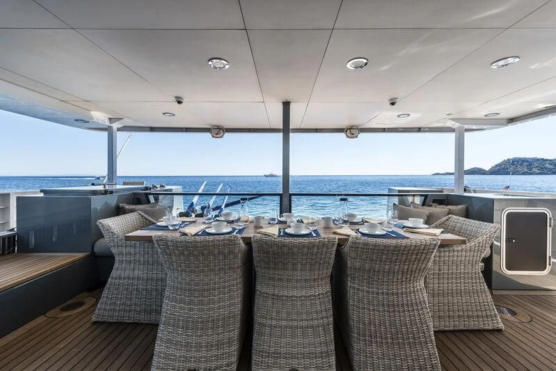a table set for a meal on a boat aboard OURWAY Yacht for Sale