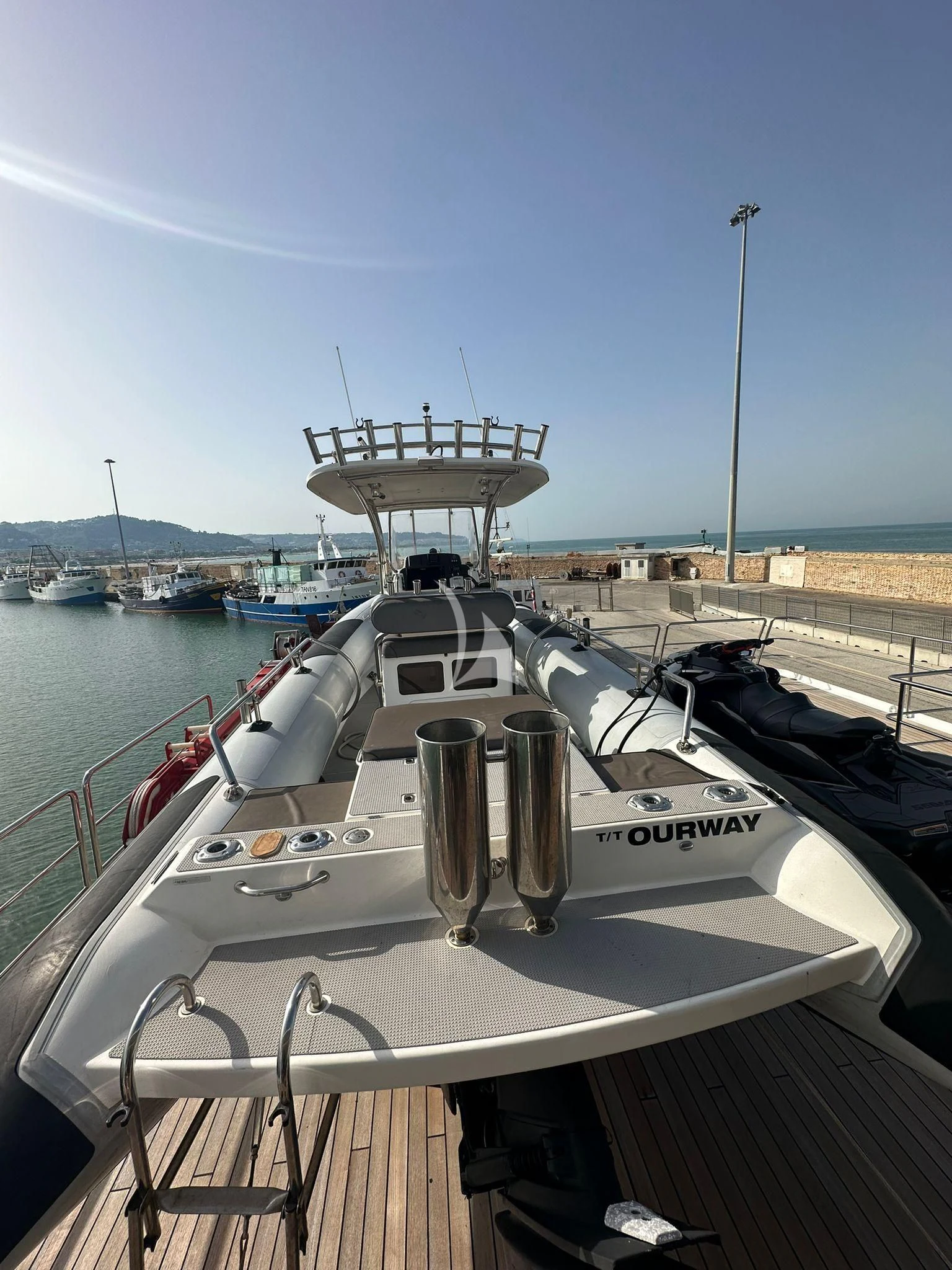 a boat docked at a pier aboard OURWAY Yacht for Sale
