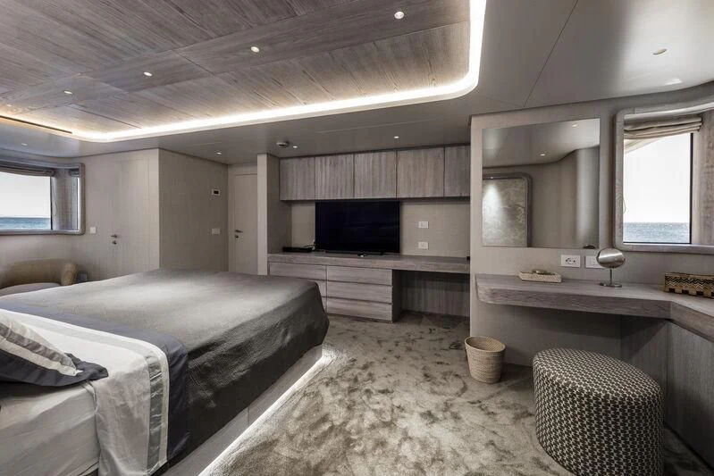 a bedroom with a bed and a tv aboard OURWAY Yacht for Sale