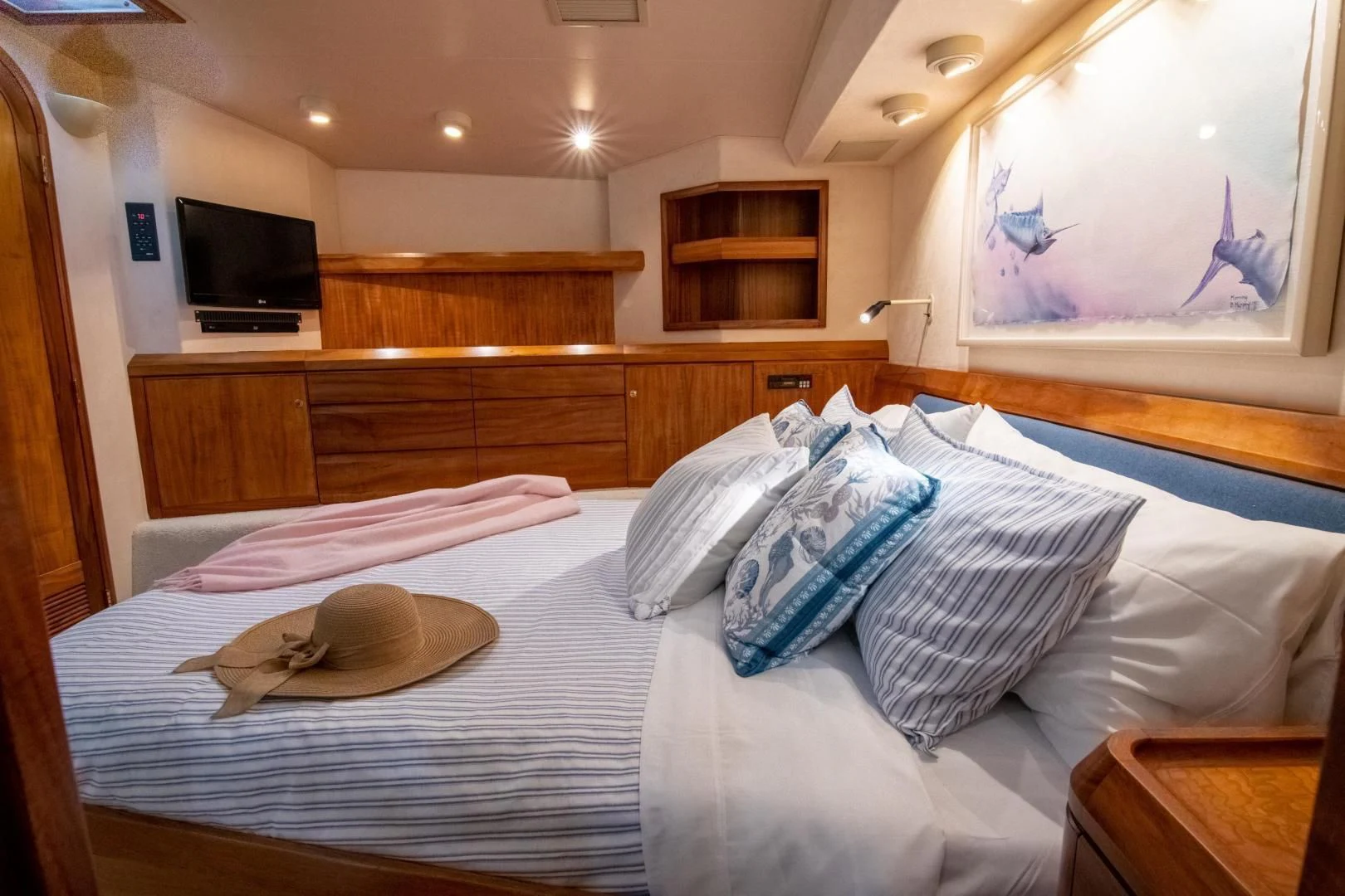 a bed with pillows on it aboard CROUPIER Yacht for Sale
