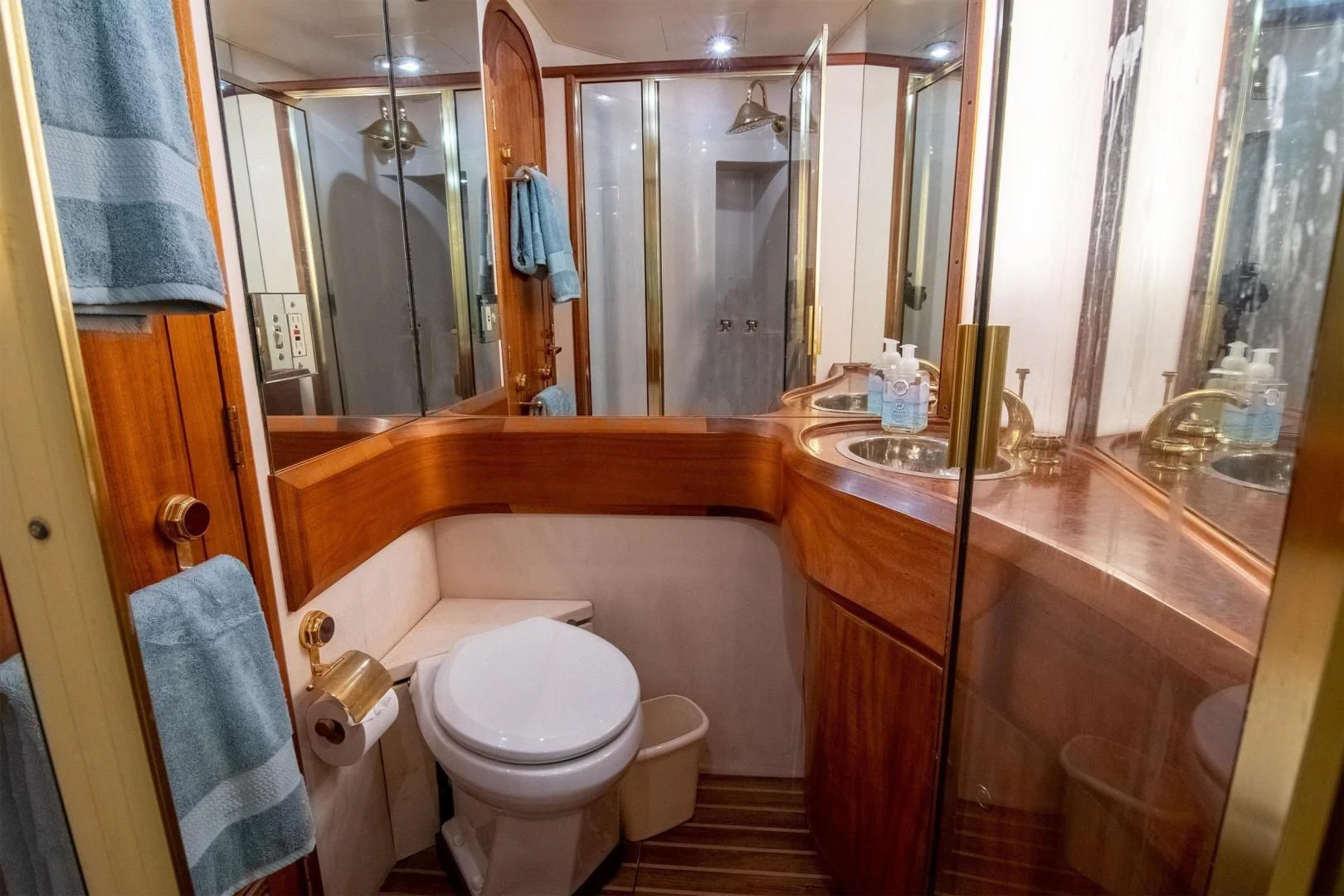 a bathroom with a toilet and a sink aboard CROUPIER Yacht for Sale