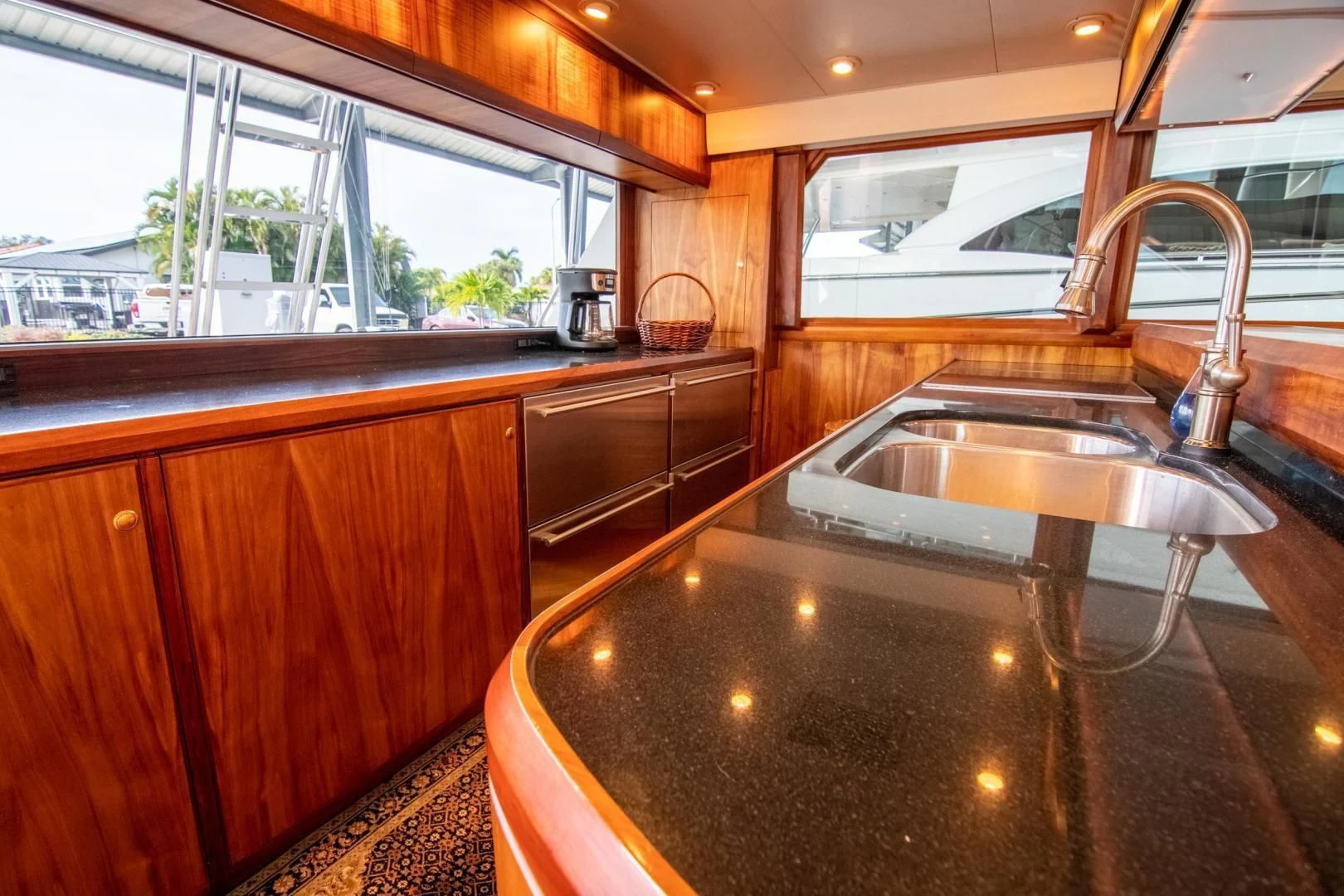 a kitchen with a stainless steel sink aboard CROUPIER Yacht for Sale