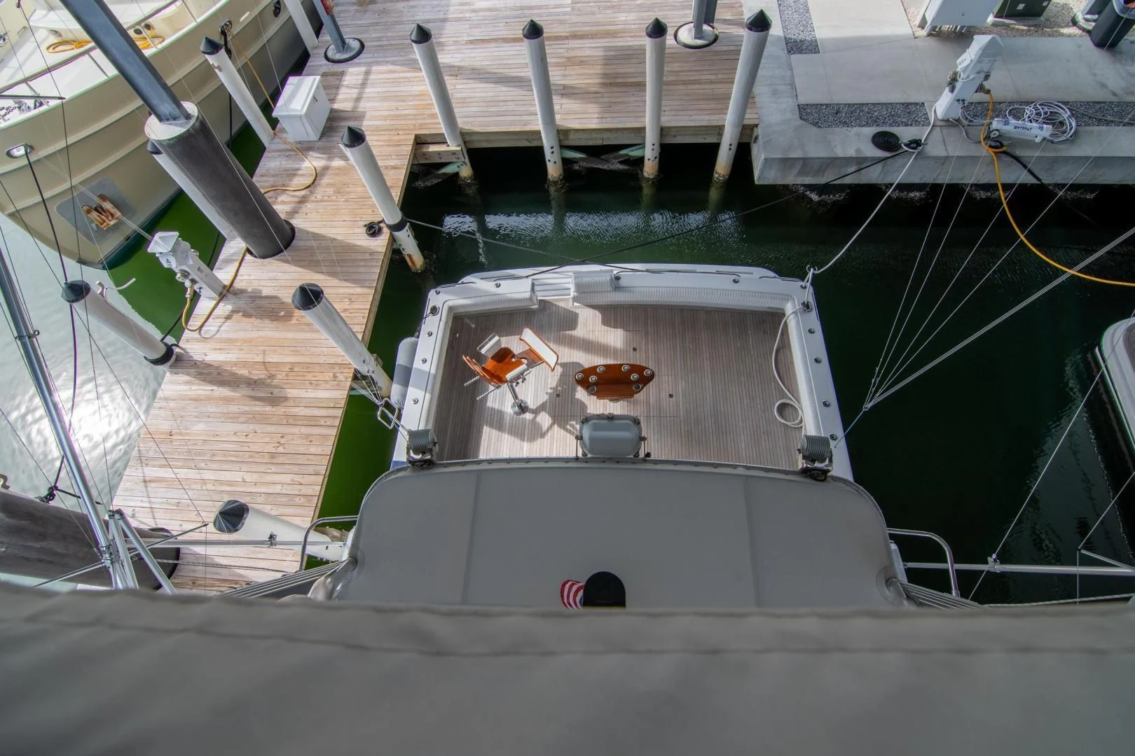 a boat docked at a pier aboard CROUPIER Yacht for Sale