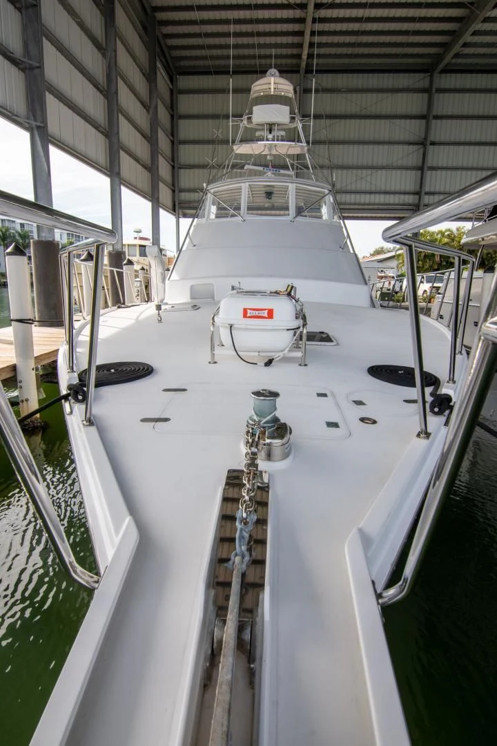 a white boat in a building aboard CROUPIER Yacht for Sale