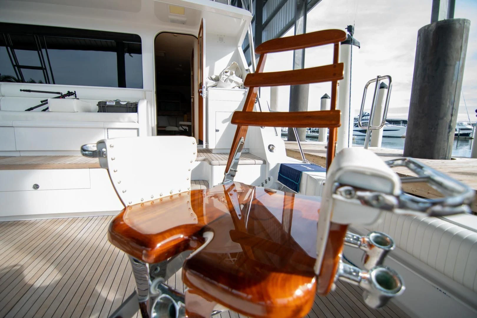 a wooden chair on a table aboard CROUPIER Yacht for Sale