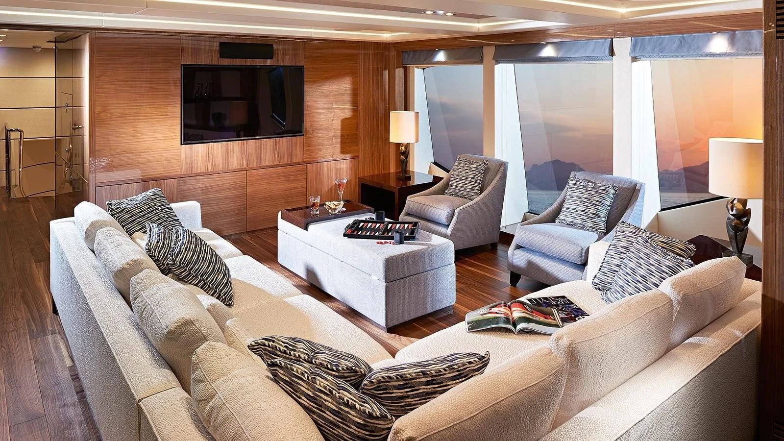 a living room with a large screen aboard FANDANGO Yacht for Sale