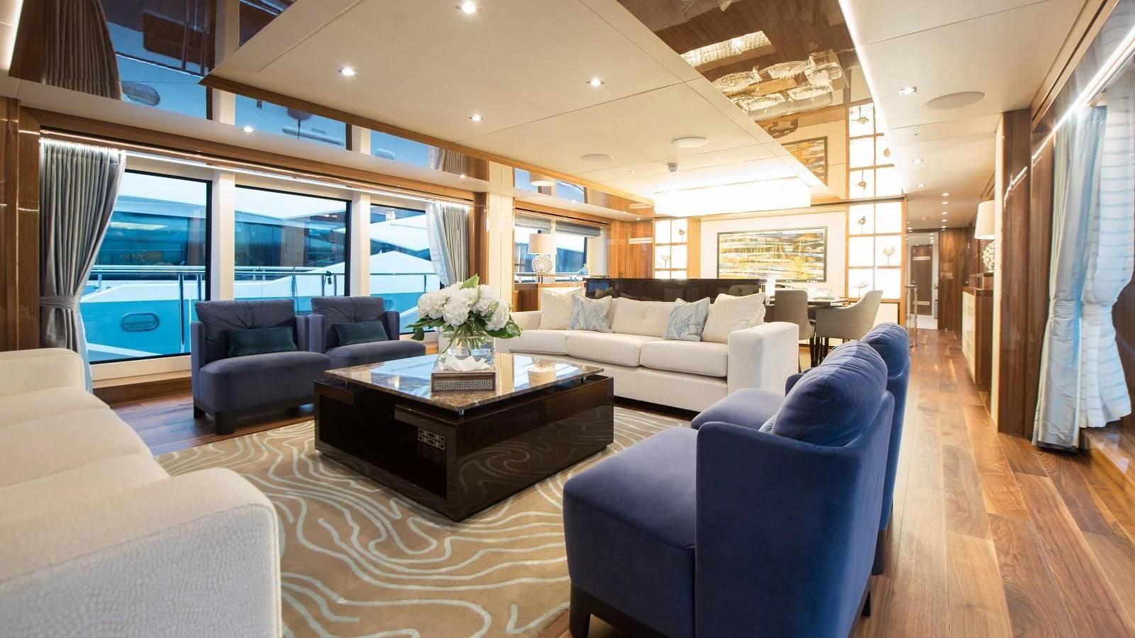 a living room with a large window aboard FANDANGO Yacht for Sale