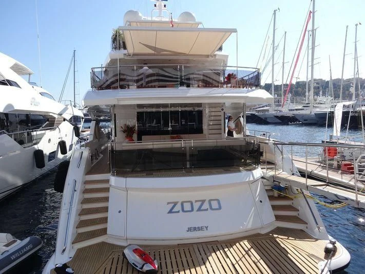 a large white boat in a harbor aboard FANDANGO Yacht for Sale