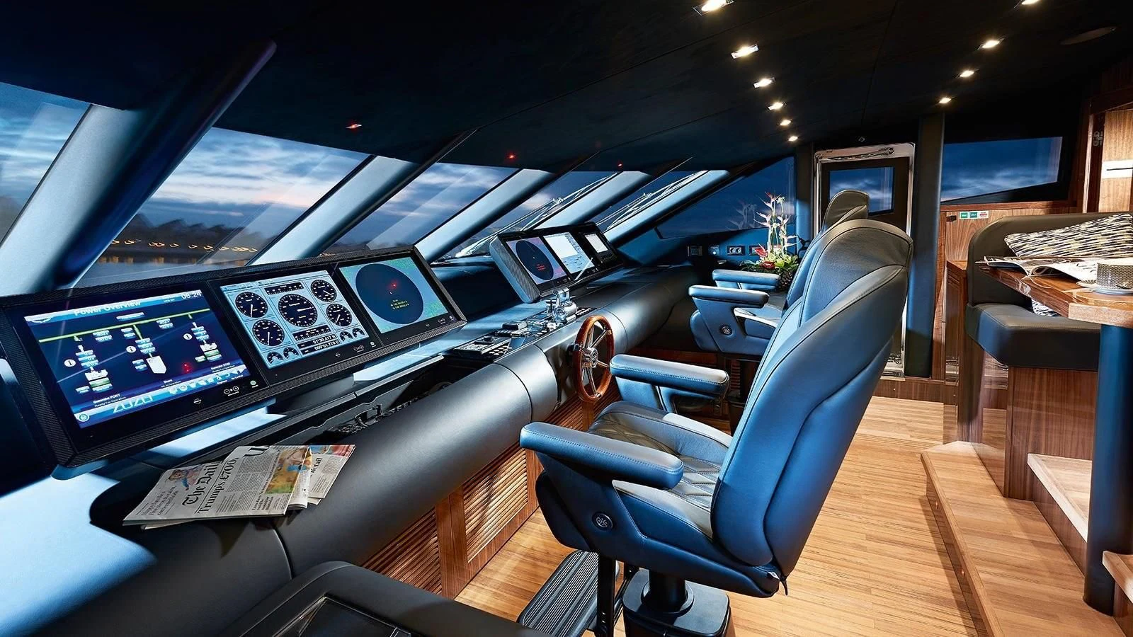 a person sitting in a chair in a control room aboard FANDANGO Yacht for Sale
