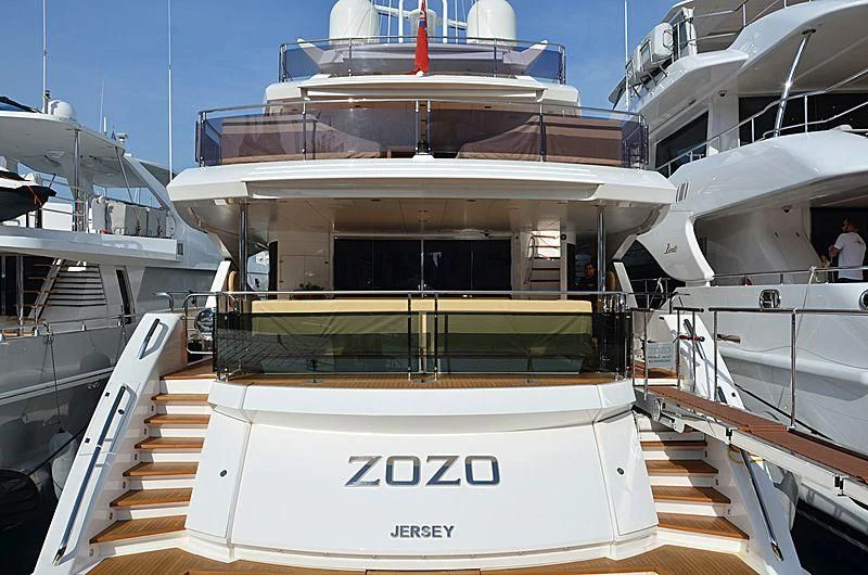 a boat with a staircase and a white sign on the front aboard FANDANGO Yacht for Sale