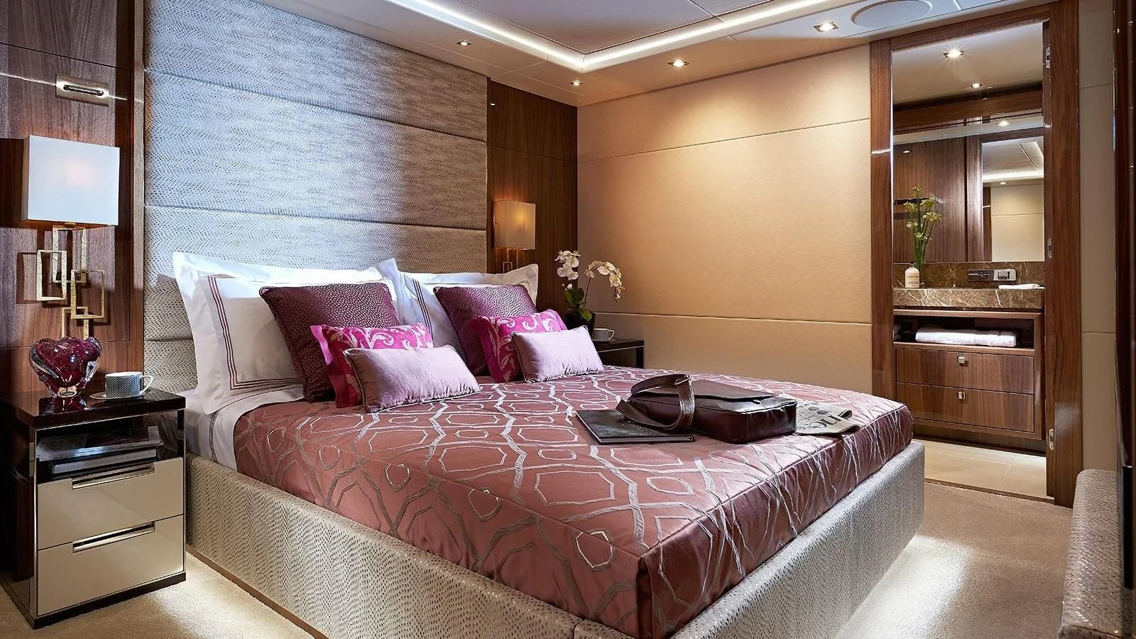 a bed with a white comforter aboard FANDANGO Yacht for Sale