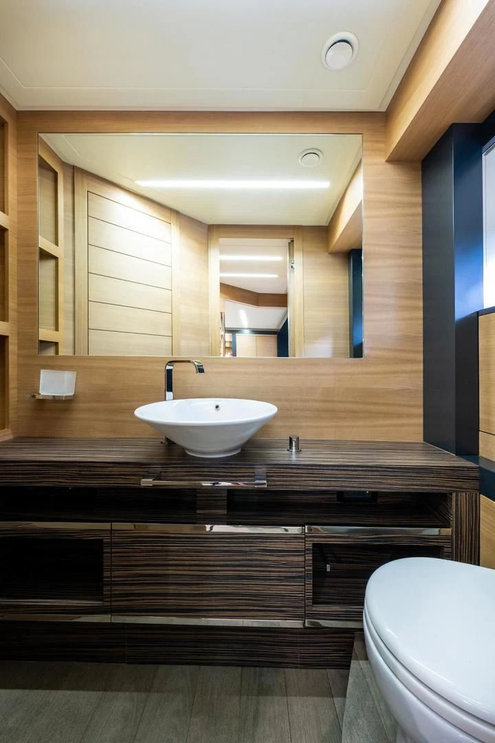 a bathroom with a large mirror aboard CLAIMS TO FAME Yacht for Sale