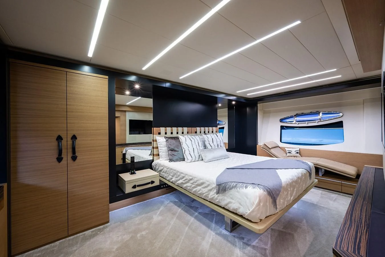 a room with a bed and a closet aboard CLAIMS TO FAME Yacht for Sale