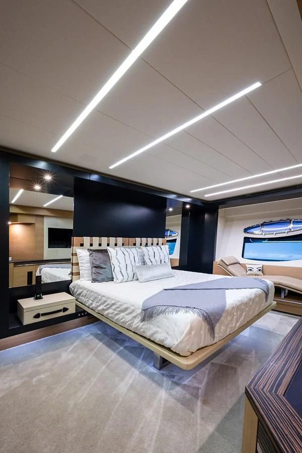 a room with a bed and a tv aboard CLAIMS TO FAME Yacht for Sale
