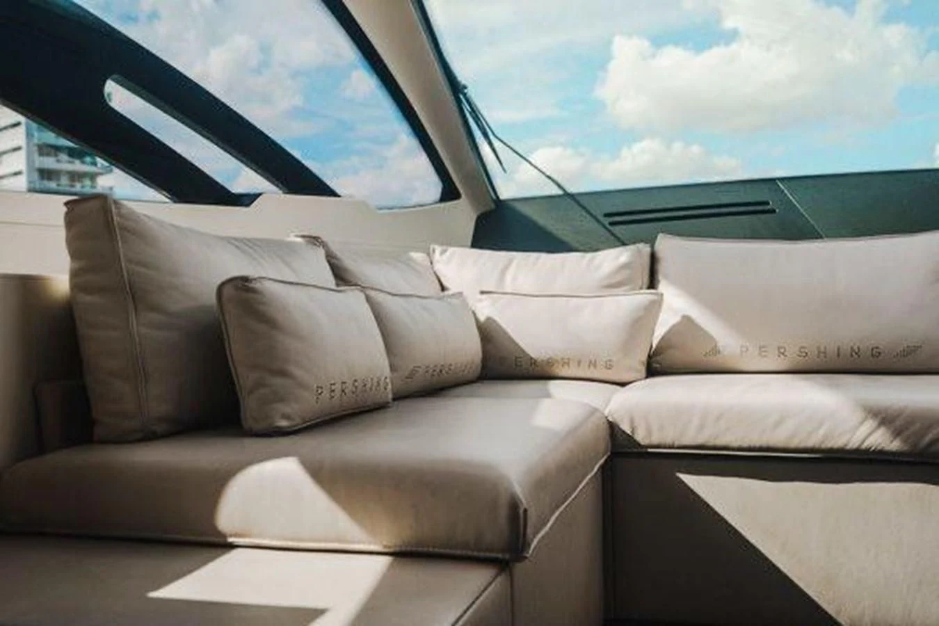 a room with couches and a window aboard CLAIMS TO FAME Yacht for Sale