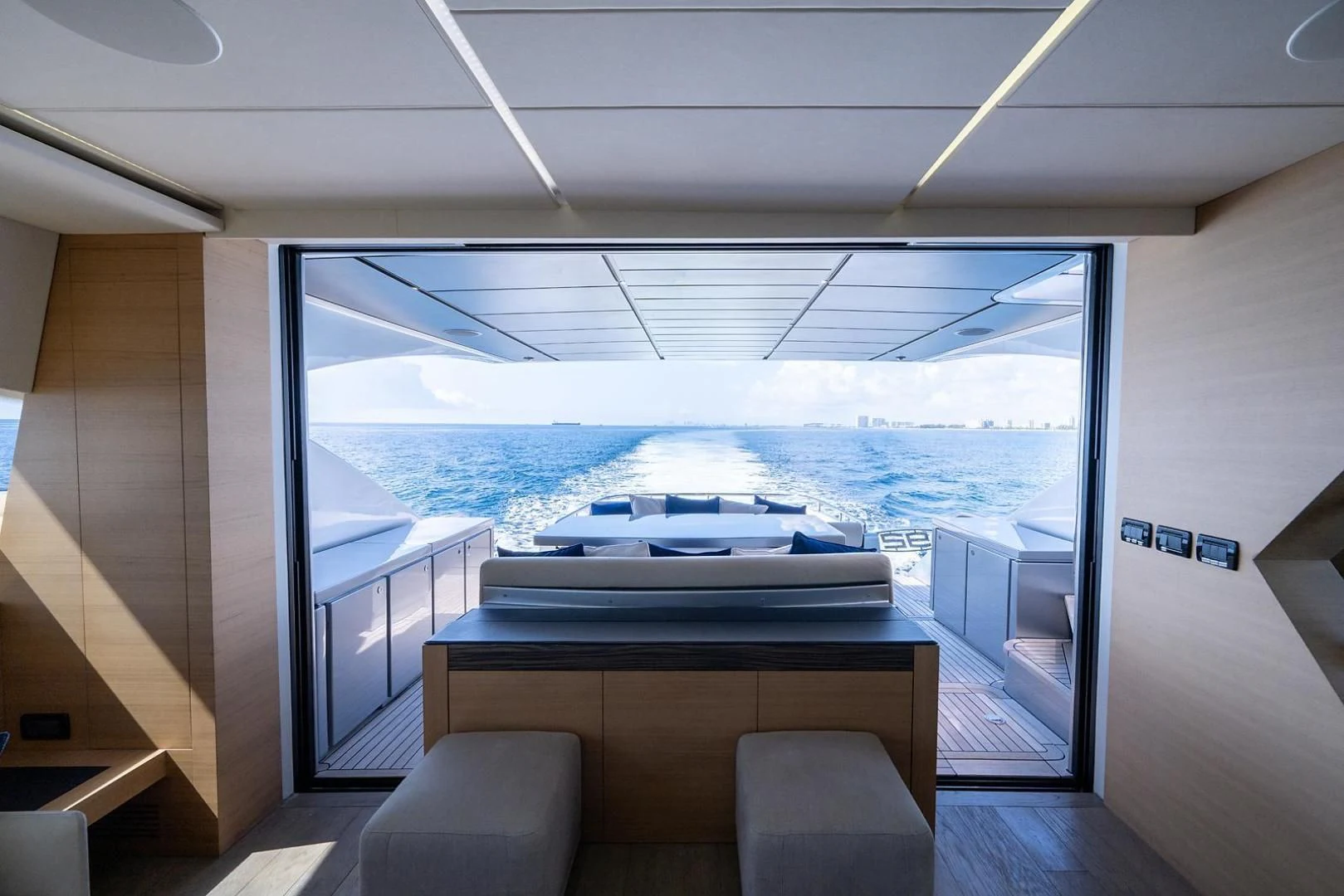 a room with a large window and a view of the ocean aboard CLAIMS TO FAME Yacht for Sale