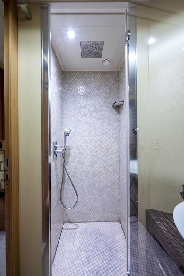 a shower unit in a bathroom aboard CLAIMS TO FAME Yacht for Sale