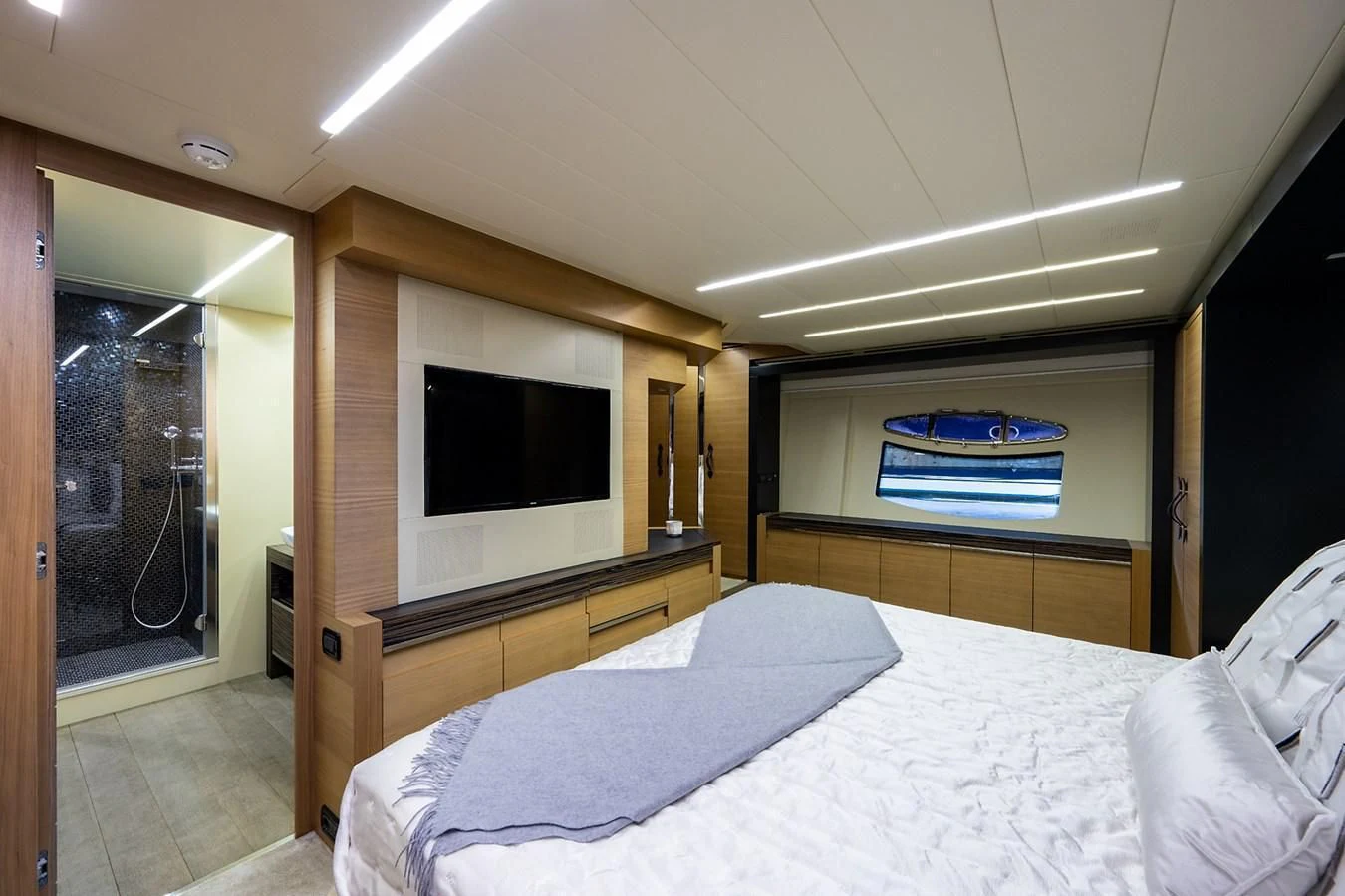 a bedroom with a bed and a television aboard CLAIMS TO FAME Yacht for Sale