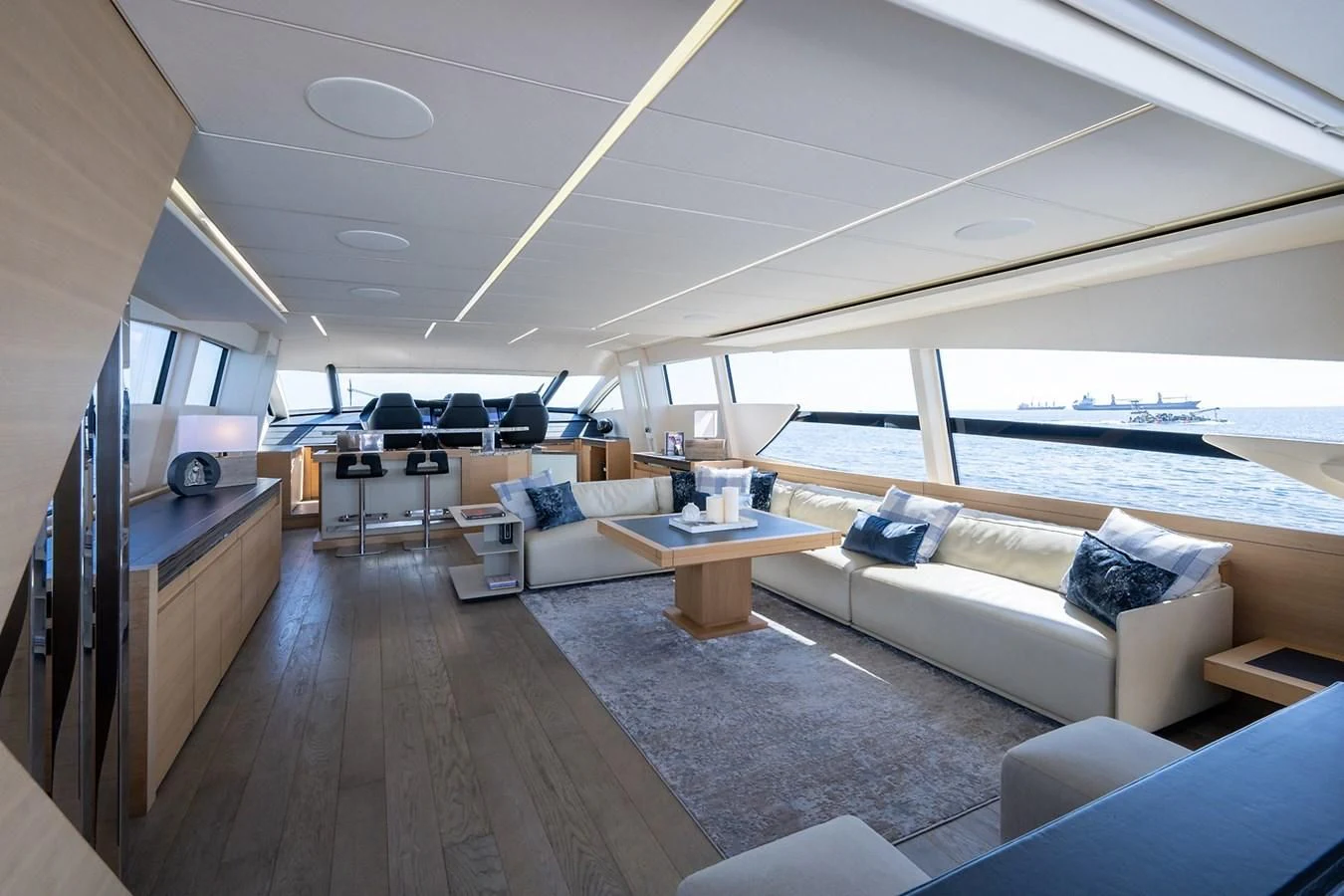 a living room with a large window aboard CLAIMS TO FAME Yacht for Sale
