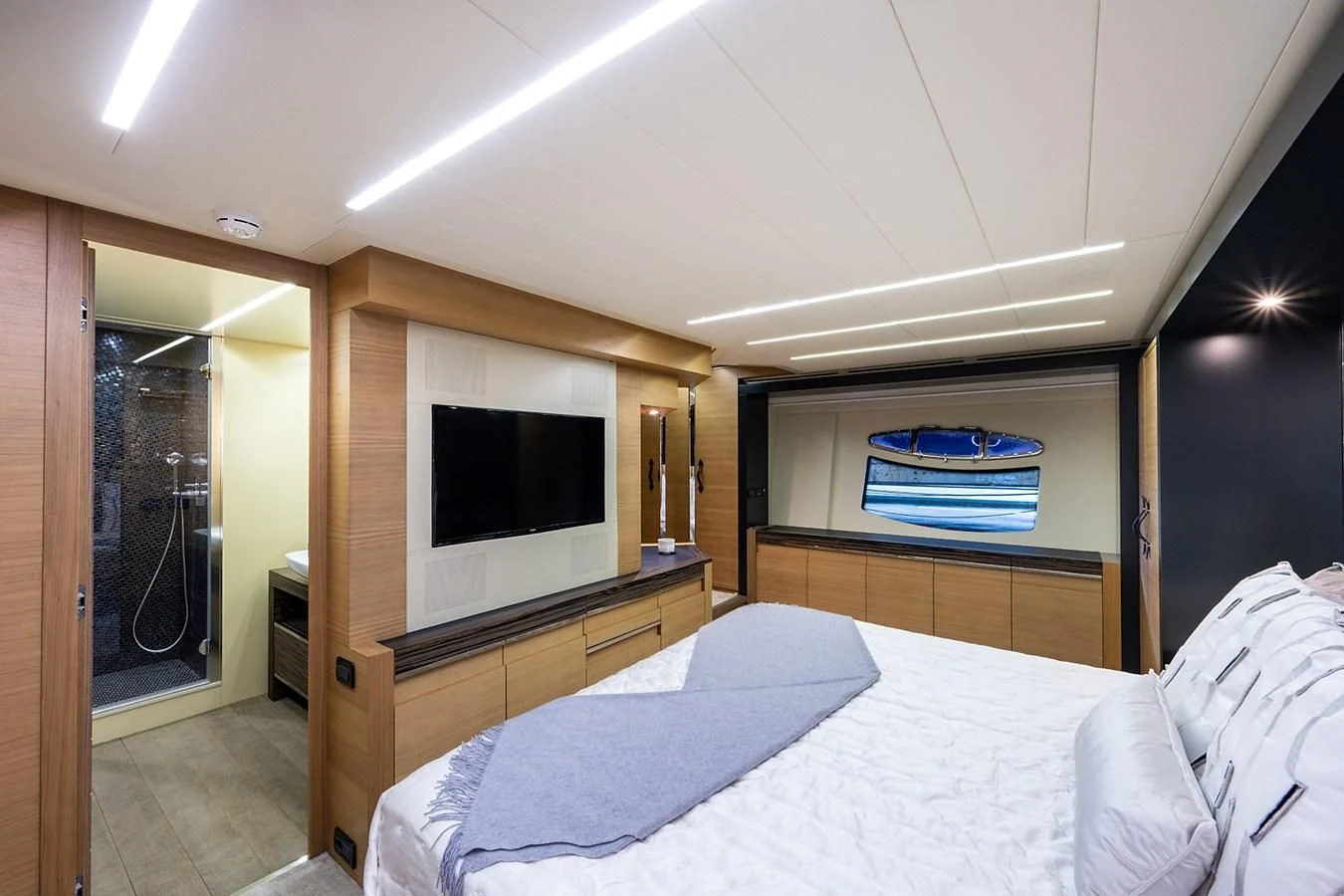 a bedroom with a bed and a television aboard CLAIMS TO FAME Yacht for Sale