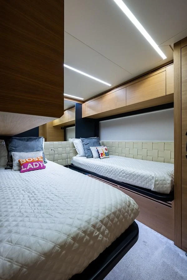 a room with two beds aboard CLAIMS TO FAME Yacht for Sale