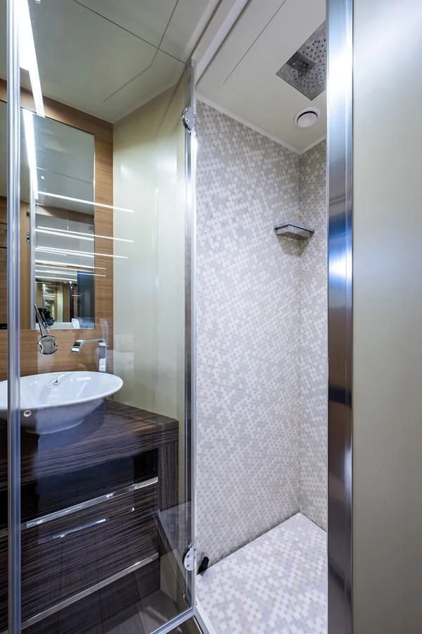 a bathroom with a sink and a shower aboard CLAIMS TO FAME Yacht for Sale