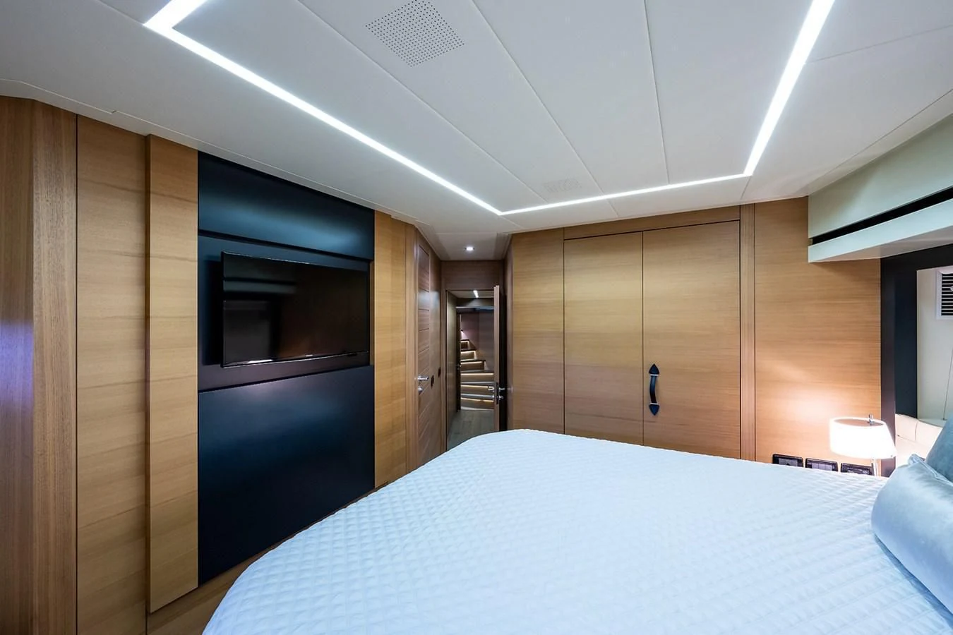 a room with a bed and a closet aboard CLAIMS TO FAME Yacht for Sale