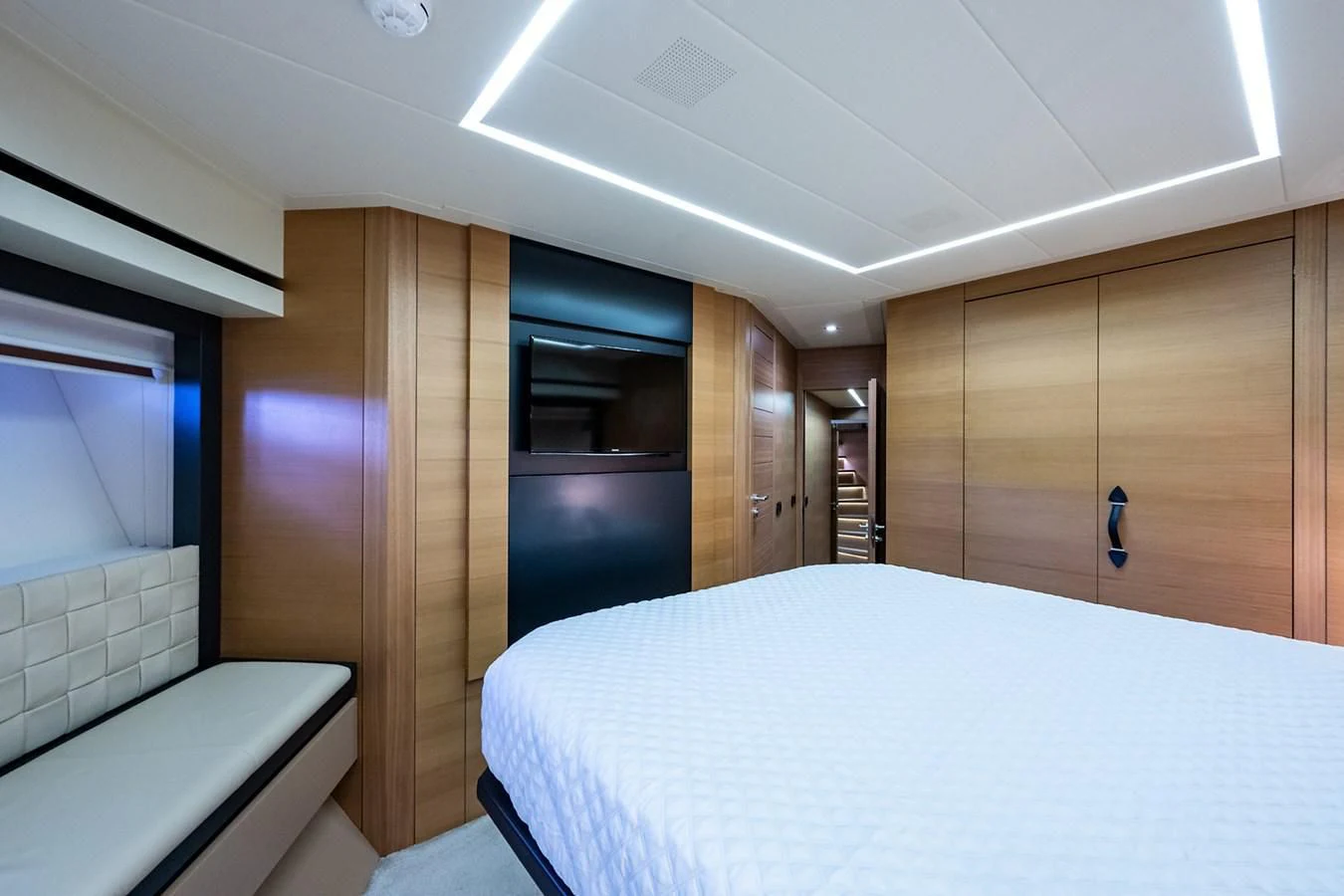 a room with a bed and a closet aboard CLAIMS TO FAME Yacht for Sale