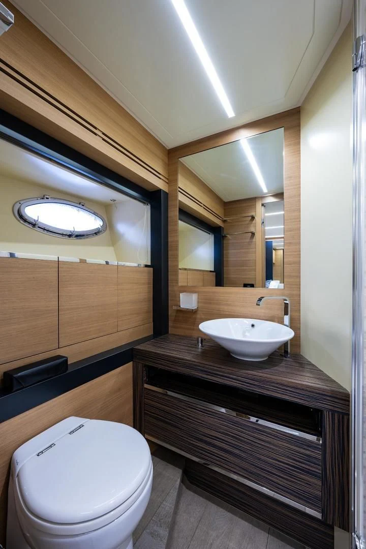 a bathroom with a sink and a toilet aboard CLAIMS TO FAME Yacht for Sale