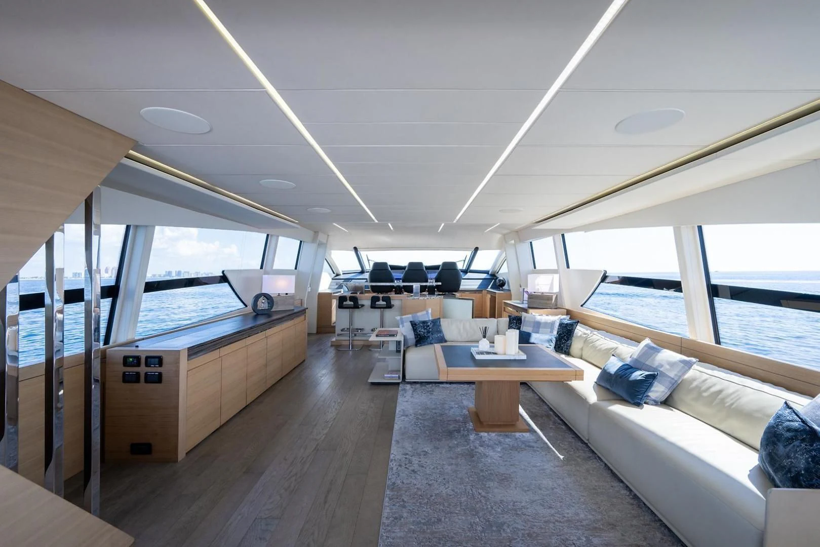 a room with a couch and a table and a window aboard CLAIMS TO FAME Yacht for Sale