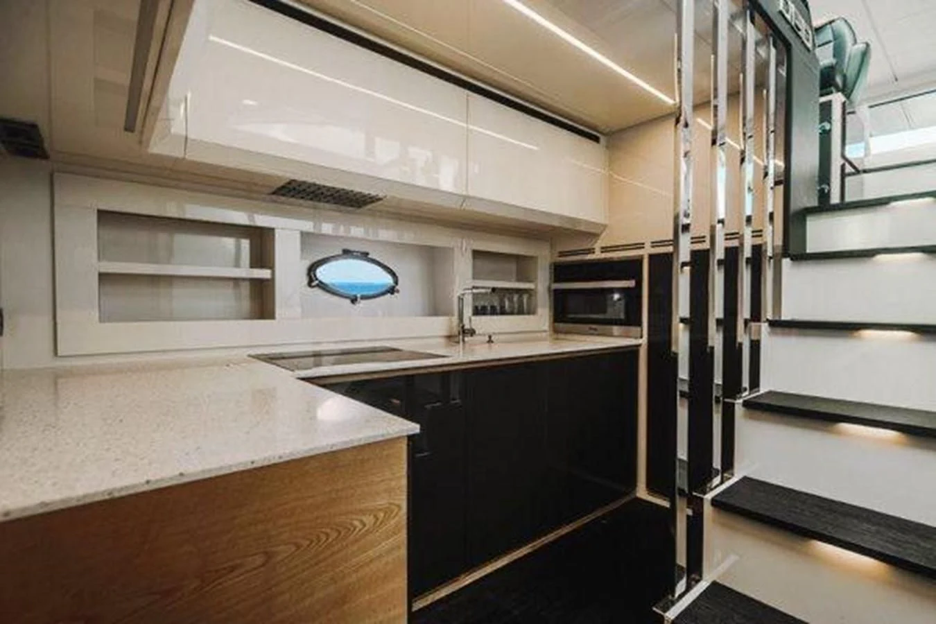 a kitchen with a large window aboard CLAIMS TO FAME Yacht for Sale