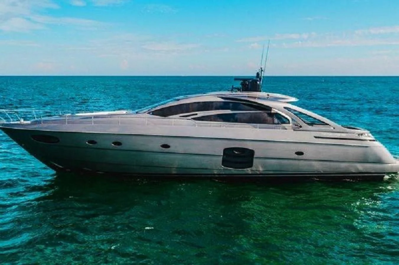 a white yacht in the water aboard CLAIMS TO FAME Yacht for Sale