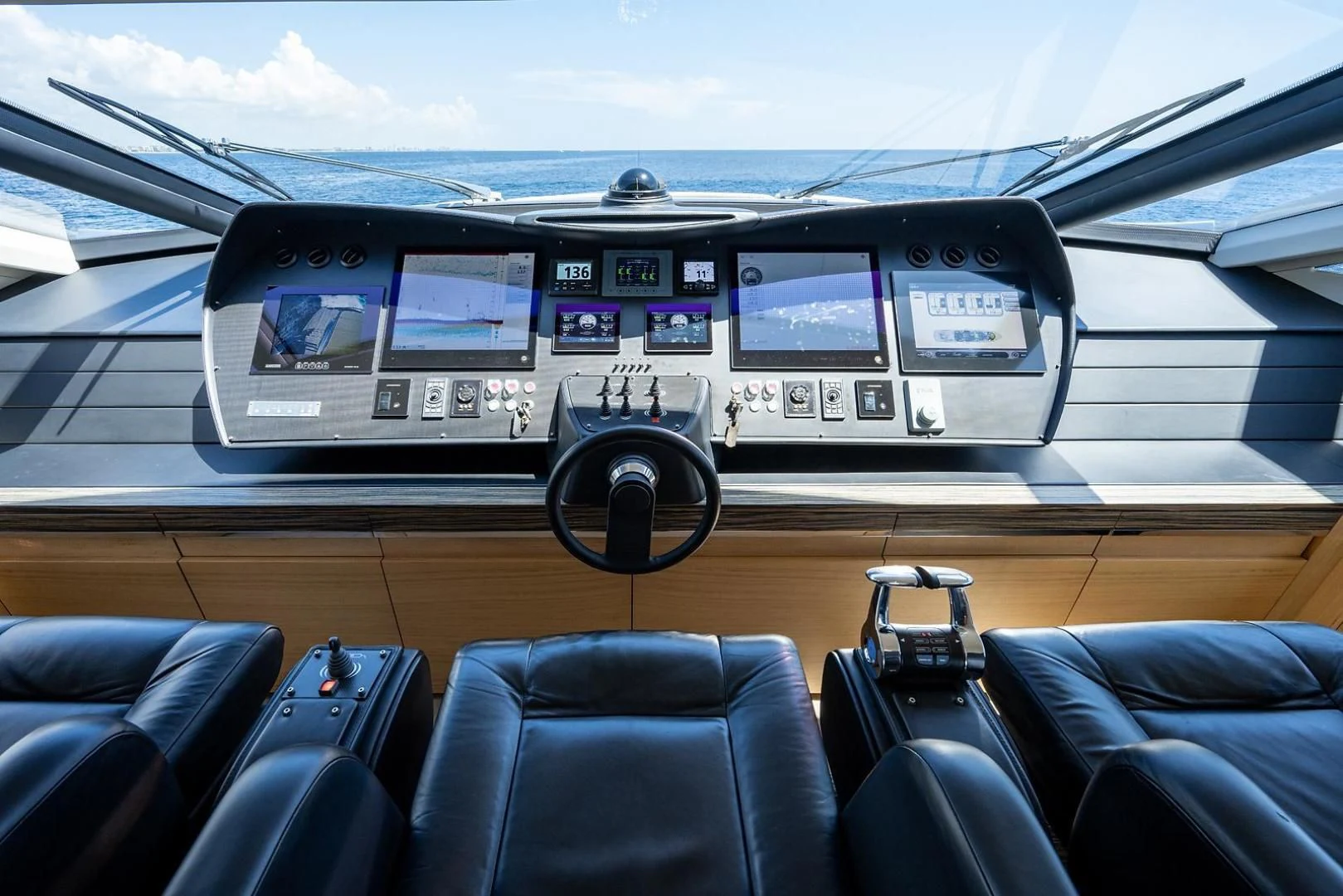 inside of a car with seats and a steering wheel and a steering wheel aboard CLAIMS TO FAME Yacht for Sale