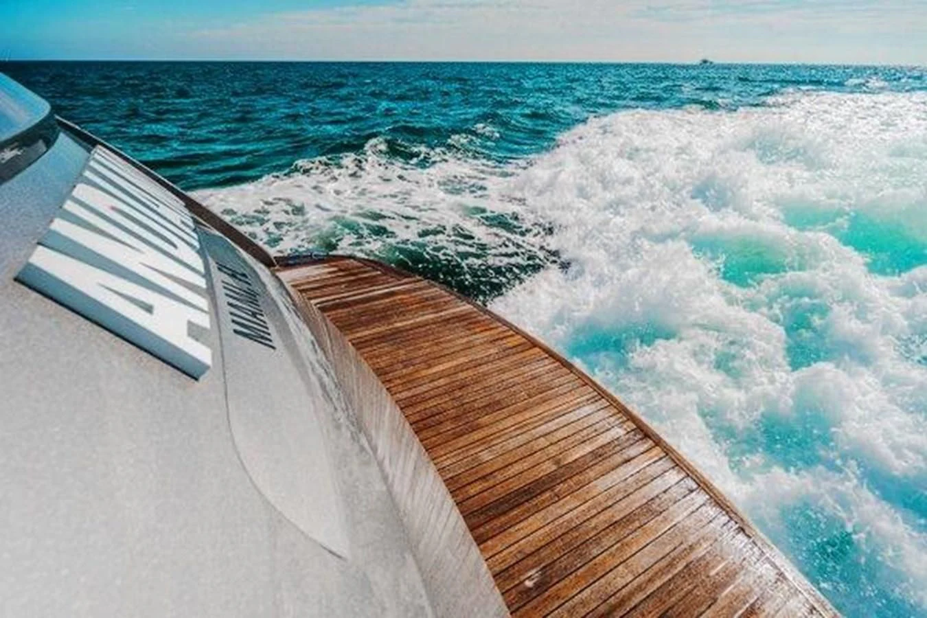 a wooden dock over a body of water aboard CLAIMS TO FAME Yacht for Sale