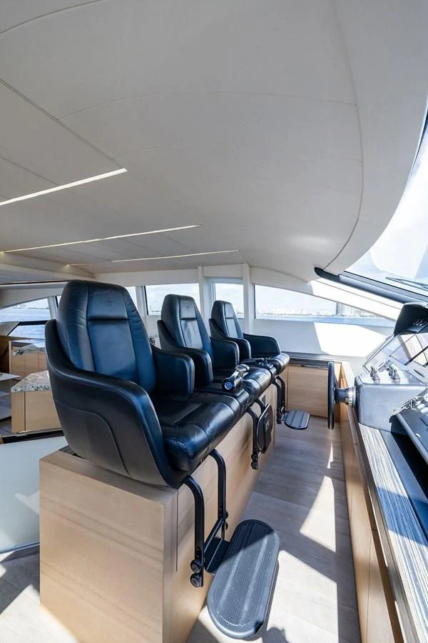 a room with chairs and tables aboard CLAIMS TO FAME Yacht for Sale