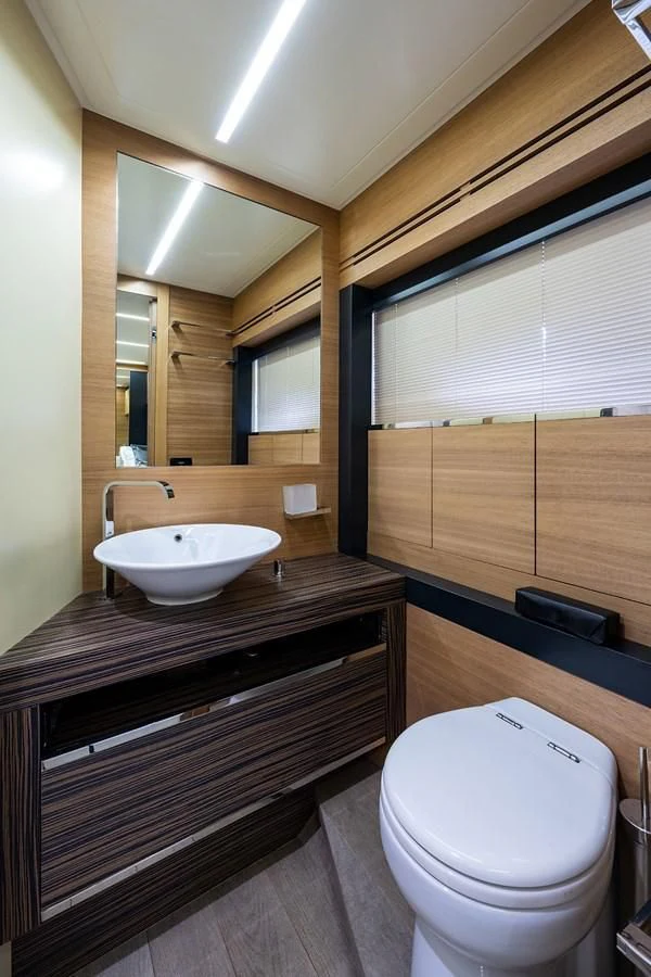 a bathroom with a sink and a toilet aboard CLAIMS TO FAME Yacht for Sale