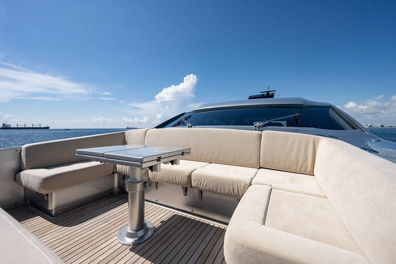a white car on a dock aboard CLAIMS TO FAME Yacht for Sale