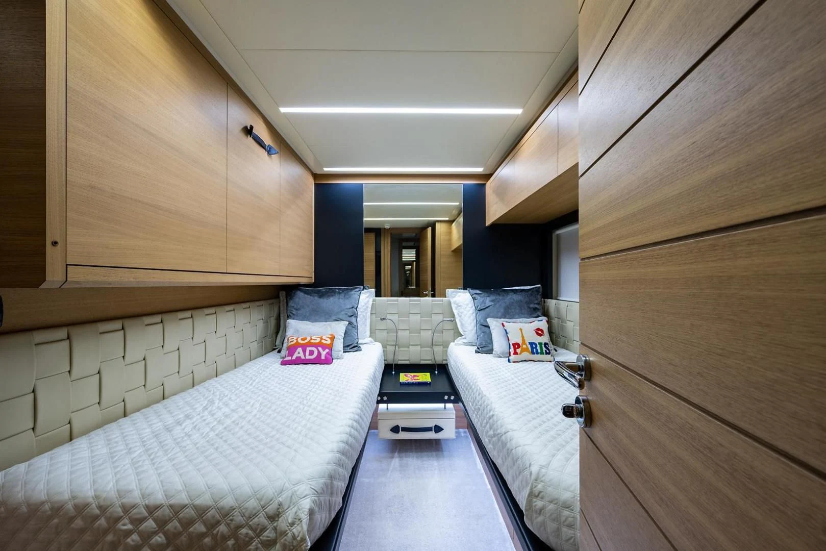 a room with a bed and a table aboard CLAIMS TO FAME Yacht for Sale