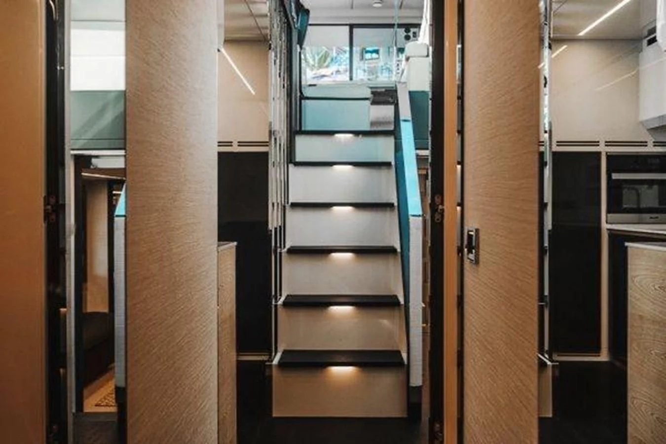 a room with a set of stairs aboard CLAIMS TO FAME Yacht for Sale