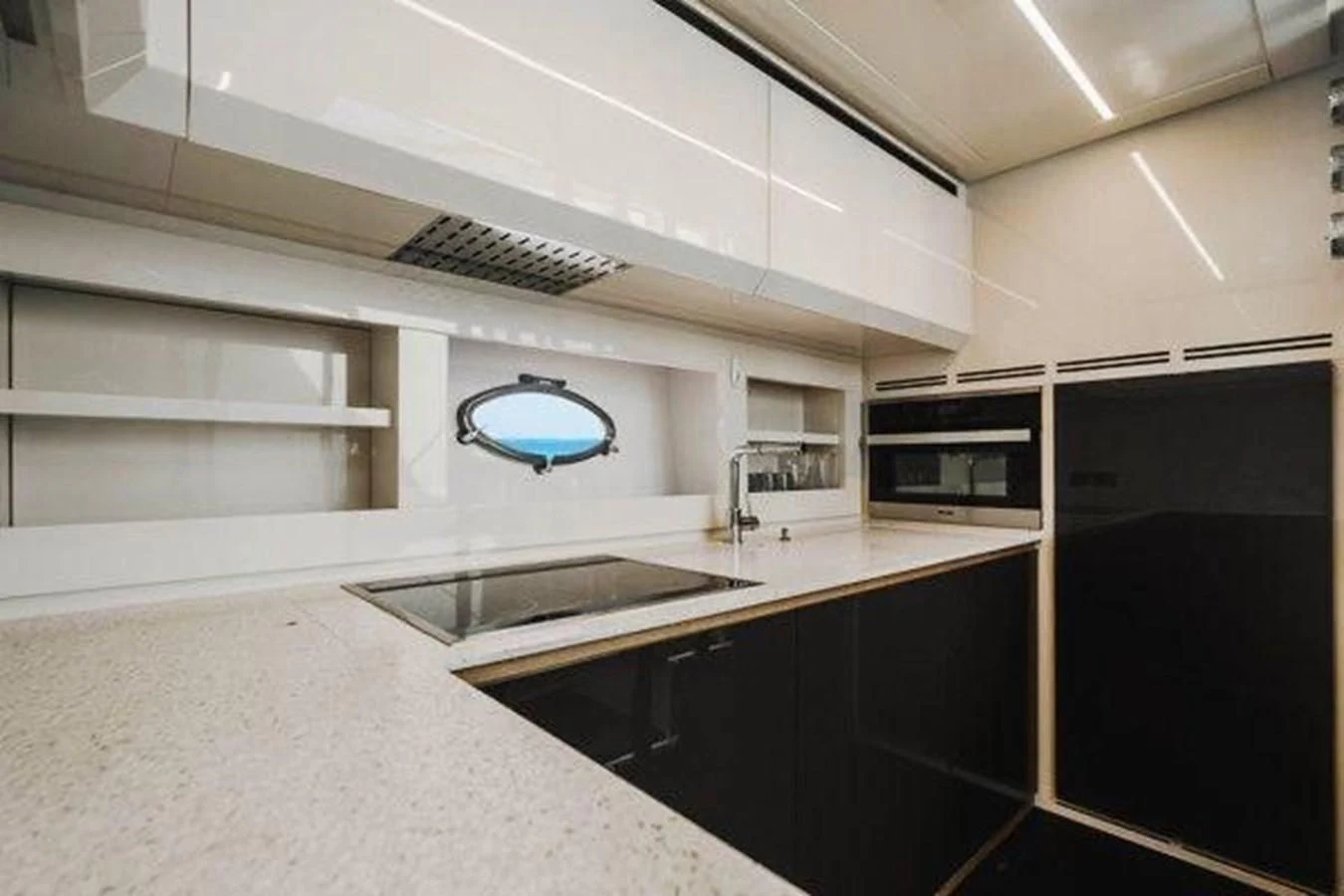 a kitchen with a sink and a microwave aboard CLAIMS TO FAME Yacht for Sale