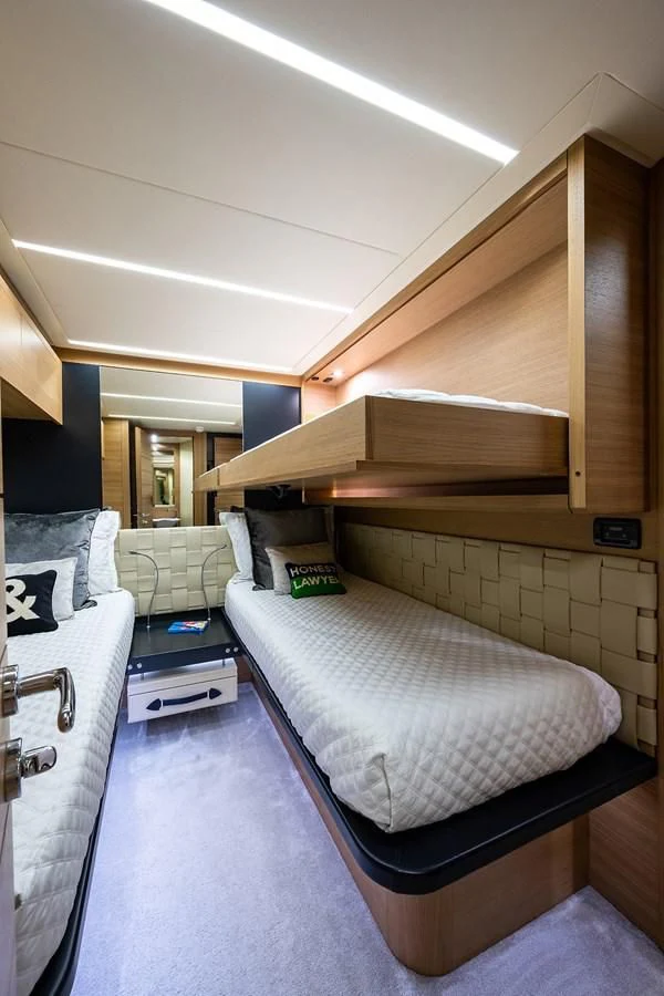 a room with a bed and a desk aboard CLAIMS TO FAME Yacht for Sale