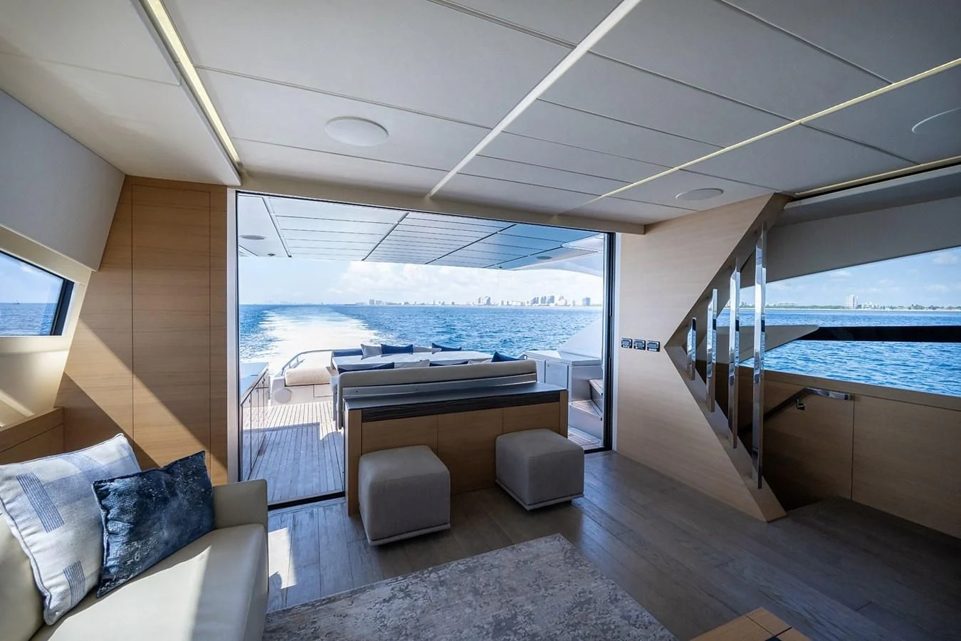 a room with a view of the ocean and the deck aboard CLAIMS TO FAME Yacht for Sale