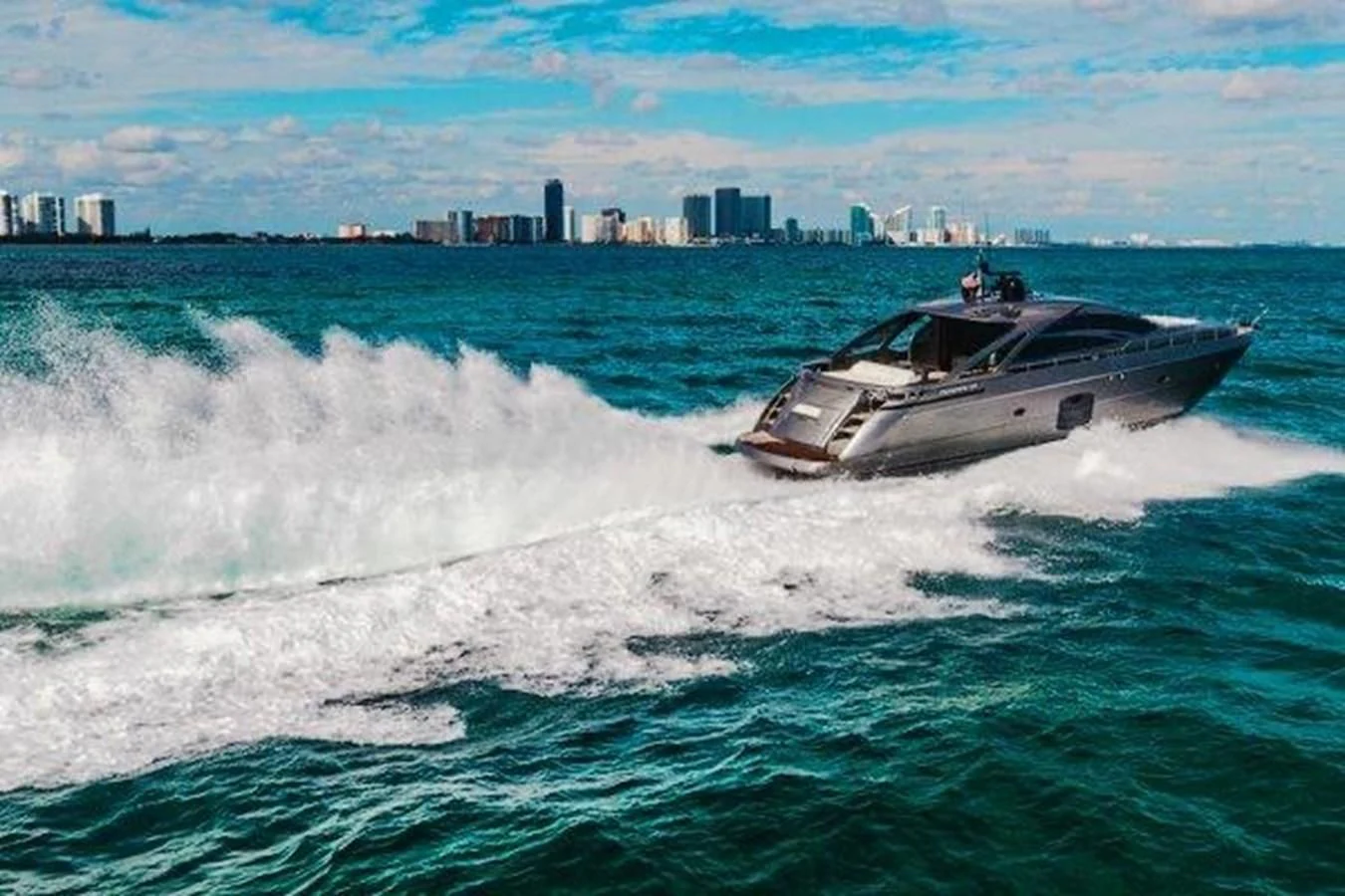 a boat splashing in the water aboard CLAIMS TO FAME Yacht for Sale